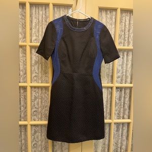 Size 10 Karen Millen dress with flattering hourglass design. Jeweled collar.